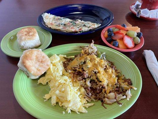 Southern Style Chorizo (front) and Veggie Delight Omelette (back) with fruit and biscuits.