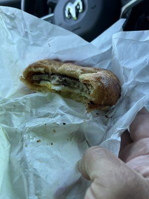 Breakfast sausage,  egg & cheese croissant.