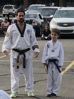 Senior Master Alex with our son at a testing.