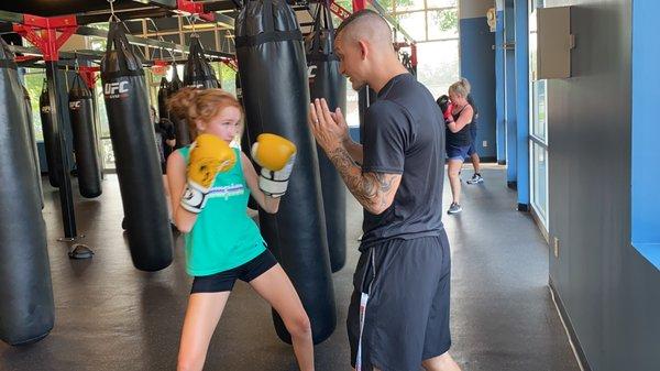 Josh showing Sophia the right techniques.