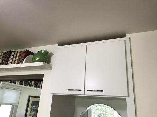 Molding was never placed at the top of his beautiful built in cabinets, which were put in over a year ago.