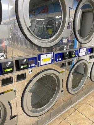 New dryers. At the 10 minute mark, they stop and start tumbling in the opposite direction to ensure even drying.