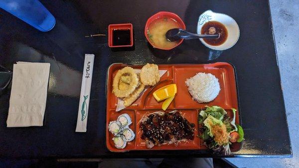 Beef teriyaki, miso, salad, California sushi pieces, rice, one shrimp and vegetable tempura, soy sauce (left), ginger dipping sauce (right)