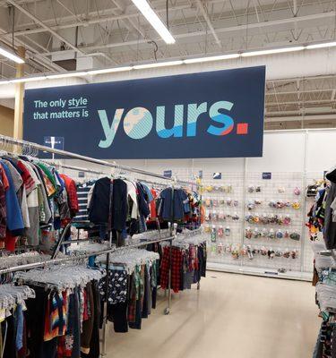 Kids clothes with signage in the back