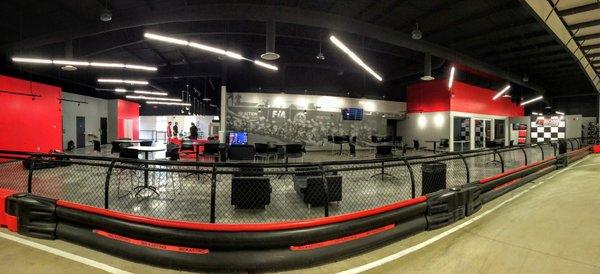 The paddock area of BOSS Pro-Karting.  Leather couches, big screen TVs, and trackside action!