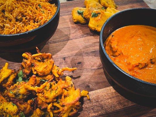 Shrimp biryani, vegetable pakora, paneer pakora, chicken coconut curry