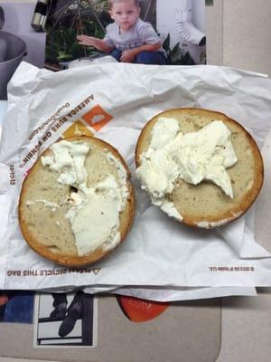 Almost toasted bagel with crumbs from something unrecognizable within; gross!