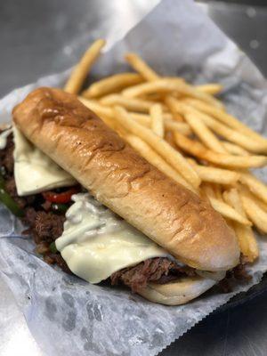 Philly Steak and cheese sandwich and French Fries