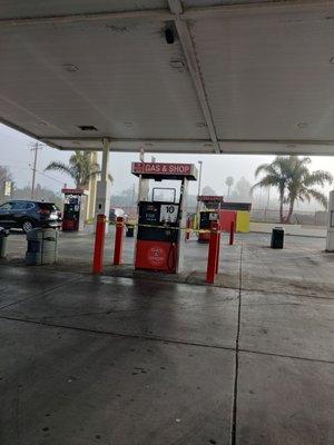 2nd gas station dispenser with yellow tape.