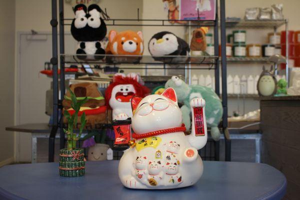 Our lucky cat and bamboo (Zangetsu) in front of our newly arrived plushies