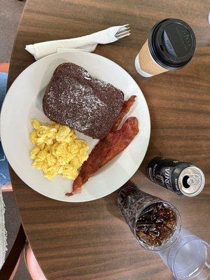 Cheeky French Toast Brunch with banana and chocolate, eggs, and bacon