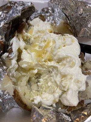 Baked Potato with Buttery Spread and Daisy Sour Cream