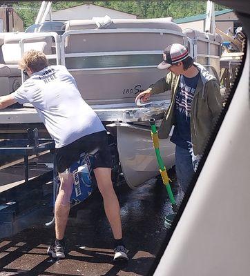 Employees cleaning a different yoat