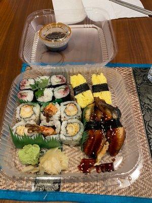 Ume shiso roll, shrimp tempura roll, tamago nigiri, and unagi nigiri.