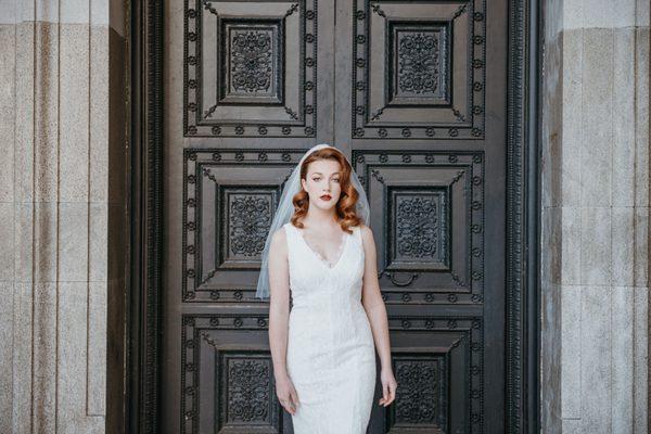 A bride in front of one of The Hibernia's front doors