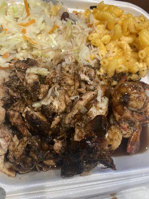 Jerk chicken with shrimp, sides of Mac n cheese and cabbage