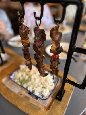 Grilled chicken and lamb hanging skewers