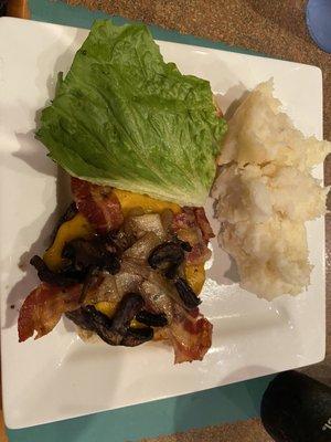 Burger w/ lettuce, sautéed onion, bacon, cheddar cheese, and mushrooms and mashed potatoes