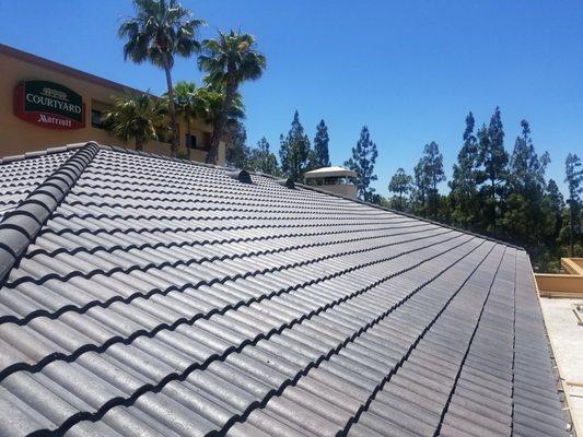 A newly installed low profile tile roof