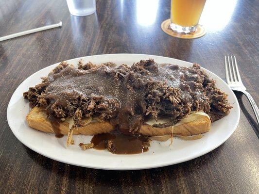 Pot Roast on toasted bread with provolone cheese, grilled mushrooms & onions, lots of roast, topped with brown gravy