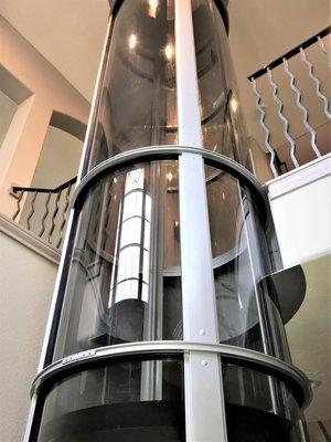 Pneumatic elevator installed in a 2-story foyer.