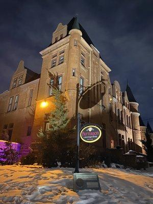 The speakeasy vibe of the tavern in the basement of the second most haunted hotel in Colorado. Look for the glow of the open sign.