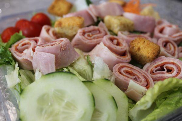 Antipasto Salad - Salad mix with shredded carrots, Cherry tomatoes, cucumbers, crouton and chunked provolone cheese topped wi...