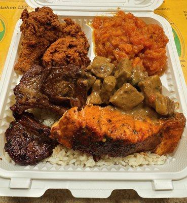 Lamb chops, salmon, steak & gravy, chicken wings, candied yams & rice "Zahid platter"