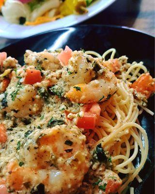 Shrimp Cristo sauteed in a seasoned olive oil with tomatoes, green onions and fete