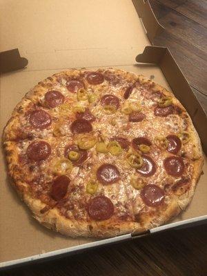 Small pizza with pepperoni and banana peppers