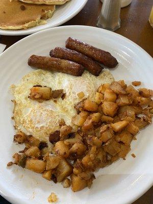 Over easy eggs  Home fries  Sausages