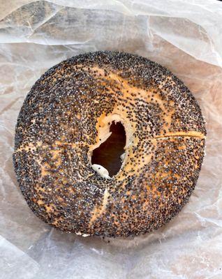 Poppy seed bagel with plain cream cheese