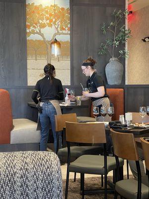 Staff cleaning table area