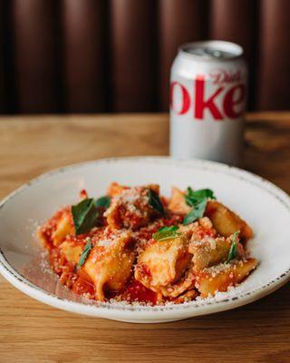 Cheese Ravioli -
Tomato sauce, parmesan blend