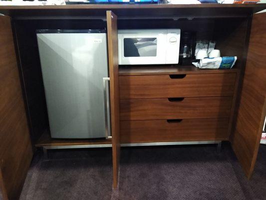 Really good size refrigerator, microwave, coffee maker, clothes drawers.