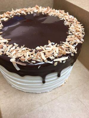 Triple coconut cake with poured chocolate ganache