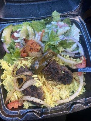 Hard old beef kabobs . Rice was old .