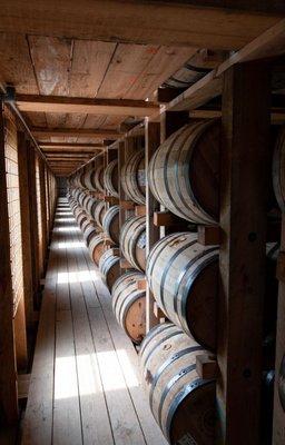 Barrels aging  in a rickhouse.