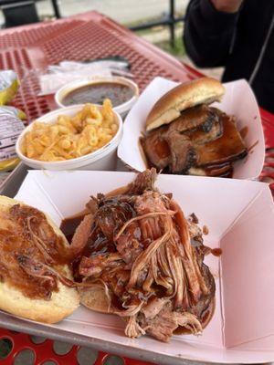 Pulled pork, beef, brisket, macaroni, and cheese, and baked beans.