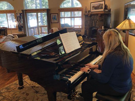 My dear wife and our beloved Yamaha C2 Piano