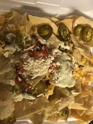 Chicken fajita nachos with jalapeños. (No chicken)