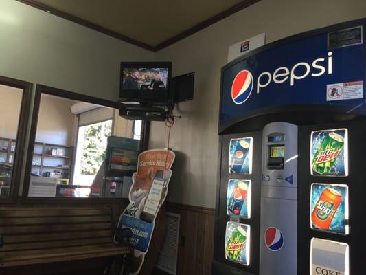 Tv and Vending machine in the waiting room.