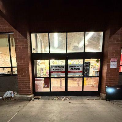 Garbage around the doors of the abandoned Safeway entrance.