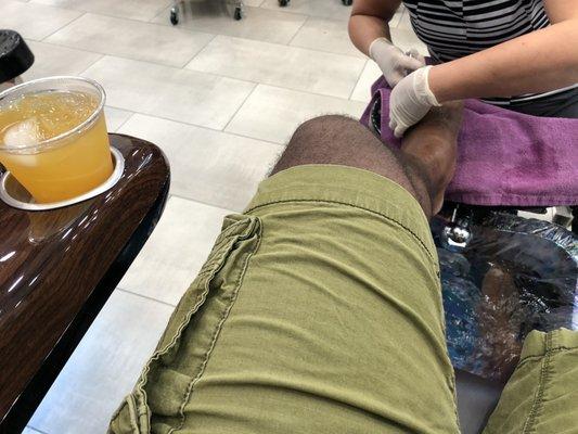 male pedicure with Jamison whiskey and a little orange