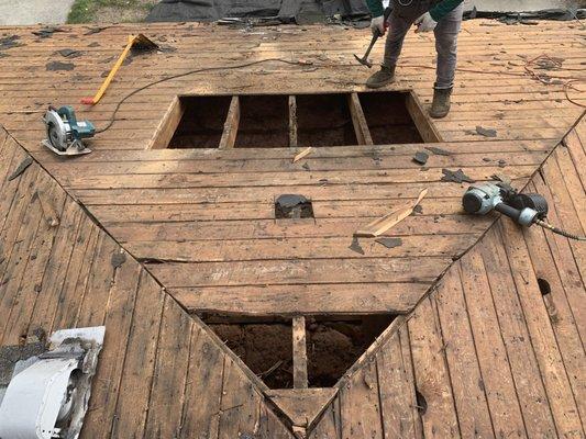 Holes in roof needing to have new wood.