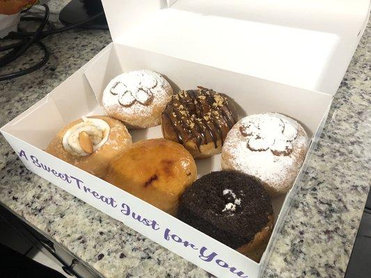 Top two:arroz con leche, top middle: peanut butter bottom left:banana donut bottom middle:creme brûlée donut bottom right:cookies&cream