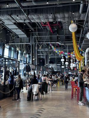 Inside. Plenty of tables and food vendors including James Beard kitchen where you can take food classes.