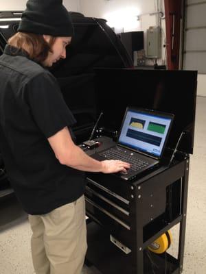 One our technicians evaluating the sound system in a Chevy Tahoe