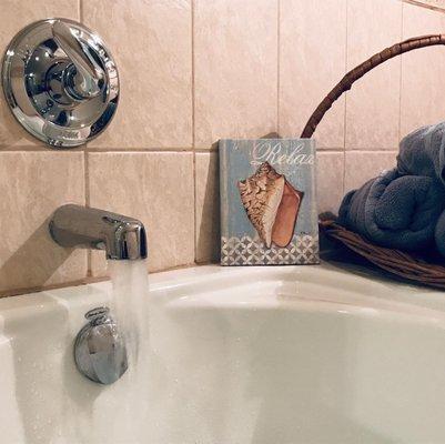 Hot water fills a jetted tub for relaxing