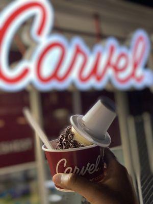 Medium vanilla cone with chocolate sprinkles in a cup